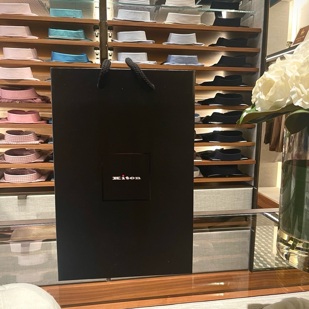 Kiton shopping bag. 8 inches long and 12 inches tall. Color black.
